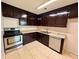 Efficient kitchen offering ample cabinetry and stainless steel appliances at 4100 Dijon Dr # 4100E, Orlando, FL 32808