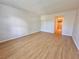 Bright bedroom with wood-look floors and access to bathroom at 4100 Dijon Dr # 4100E, Orlando, FL 32808
