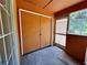 Covered lanai with double doors and screen enclosure at 4100 Dijon Dr # 4100E, Orlando, FL 32808