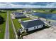 Aerial view of a home with backyard patio and fire pit at 2645 Bittern Bnd, Saint Cloud, FL 34771