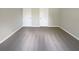 Large bedroom with grey carpeting and neutral walls at 920 Benjamin Trl, Davenport, FL 33837