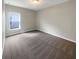 Bright bedroom with carpeted floor and large window at 920 Benjamin Trl, Davenport, FL 33837