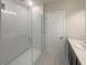 Bathroom with a walk-in shower and modern fixtures at 920 Benjamin Trl, Davenport, FL 33837