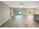 Bright and spacious living room with sliding glass doors leading to the backyard at 920 Benjamin Trl, Davenport, FL 33837