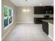 Spacious dining area with large window and tile floor at 920 Benjamin Trl, Davenport, FL 33837