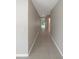 Bright hallway with tile flooring and neutral wall tones at 920 Benjamin Trl, Davenport, FL 33837