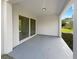 Covered patio with sliding glass doors at 920 Benjamin Trl, Davenport, FL 33837