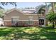 Two-story house with stone accents and solar panels at 1301 Kintla Rd, Apopka, FL 32712