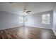 Spacious bedroom featuring wood-look floors and ceiling fan at 1301 Kintla Rd, Apopka, FL 32712