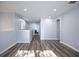 Light and airy hallway with wood-look floors at 1301 Kintla Rd, Apopka, FL 32712