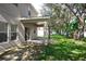 Spacious backyard with covered patio and lush green grass at 1301 Kintla Rd, Apopka, FL 32712