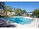 Community pool with lounge chairs and a pergola at 1301 Kintla Rd, Apopka, FL 32712