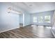 Spacious dining area with hardwood floors and modern light fixture at 1301 Kintla Rd, Apopka, FL 32712