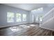 Bright living room with hardwood floors and neutral walls at 1301 Kintla Rd, Apopka, FL 32712