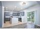Modern kitchen with gray cabinets, quartz countertops and stainless steel appliances at 1301 Kintla Rd, Apopka, FL 32712