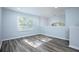 Bright bonus room with wood-look floors and large window at 1301 Kintla Rd, Apopka, FL 32712