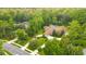 Large home on a wooded lot with a circular driveway at 2083 Biltmore Pt, Longwood, FL 32779