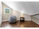 Cozy loft area with beanbag chair and wood flooring at 2083 Biltmore Pt, Longwood, FL 32779