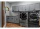 Laundry room with gray cabinets, LG washer and dryer, and countertop at 2083 Biltmore Pt, Longwood, FL 32779