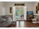 Relaxing living room with French doors opening to pool at 2083 Biltmore Pt, Longwood, FL 32779