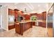 Spacious kitchen with island, stainless steel appliances, and dark wood cabinets at 2083 Biltmore Pt, Longwood, FL 32779