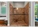Walk-in shower with glass enclosure and built-in seat at 2083 Biltmore Pt, Longwood, FL 32779