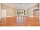 Spacious living area with hardwood floors and French doors leading to patio at 2083 Biltmore Pt, Longwood, FL 32779