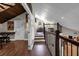 View of a loft area with wood flooring and a railing overlooking the lower level at 2083 Biltmore Pt, Longwood, FL 32779