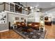 Spacious living room with high ceilings, leather sofas and a view of the kitchen at 2083 Biltmore Pt, Longwood, FL 32779