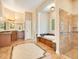 Primary bathroom with soaking tub, walk-in shower, and and sinks at 2083 Biltmore Pt, Longwood, FL 32779