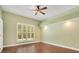 Bedroom with hardwood floors and a large window at 2083 Biltmore Pt, Longwood, FL 32779