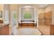 Primary bathroom with soaking tub, walk-in shower, and and sinks at 2083 Biltmore Pt, Longwood, FL 32779