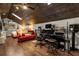 Large bonus room with wood ceiling, workspace, and comfy seating at 2083 Biltmore Pt, Longwood, FL 32779