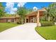 Brick home with covered entryway and manicured landscaping at 2083 Biltmore Pt, Longwood, FL 32779