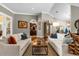 Bright living room featuring two sofas and a coffee table at 2083 Biltmore Pt, Longwood, FL 32779
