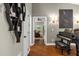 Elegant hallway with hardwood floors and view of living room at 2083 Biltmore Pt, Longwood, FL 32779