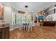 Bright breakfast nook with glass table and view of Gathering room at 2083 Biltmore Pt, Longwood, FL 32779