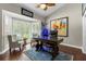 Home office with built-in bookshelves and hardwood floors at 2083 Biltmore Pt, Longwood, FL 32779