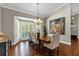Bright dining room featuring a wood table and bay window at 2083 Biltmore Pt, Longwood, FL 32779