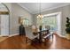 Elegant dining room with hardwood floors and a wooden table at 2083 Biltmore Pt, Longwood, FL 32779