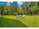 Spacious backyard with fire pit and seating area at 2083 Biltmore Pt, Longwood, FL 32779
