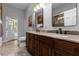 Bathroom with double vanity and access to pool area at 2083 Biltmore Pt, Longwood, FL 32779