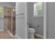 Modern bathroom with glass shower and toilet at 2083 Biltmore Pt, Longwood, FL 32779