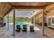 Relaxing pool area with covered patio and lounge chairs at 2083 Biltmore Pt, Longwood, FL 32779