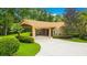 Brick home with covered entry and meticulously maintained landscaping at 2083 Biltmore Pt, Longwood, FL 32779