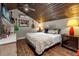 Spacious main bedroom with a king-size bed and wood flooring at 2083 Biltmore Pt, Longwood, FL 32779