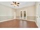 Bright bedroom with hardwood floors and french doors leading to the pool at 2083 Biltmore Pt, Longwood, FL 32779