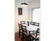 Dining area with black table and chairs, stylish decor at 605 Oakpoint Cir, Davenport, FL 33837