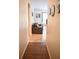 Bright hallway with wood-look flooring leading to living area at 605 Oakpoint Cir, Davenport, FL 33837