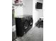 Laundry room with washer, dryer, and shelving at 605 Oakpoint Cir, Davenport, FL 33837